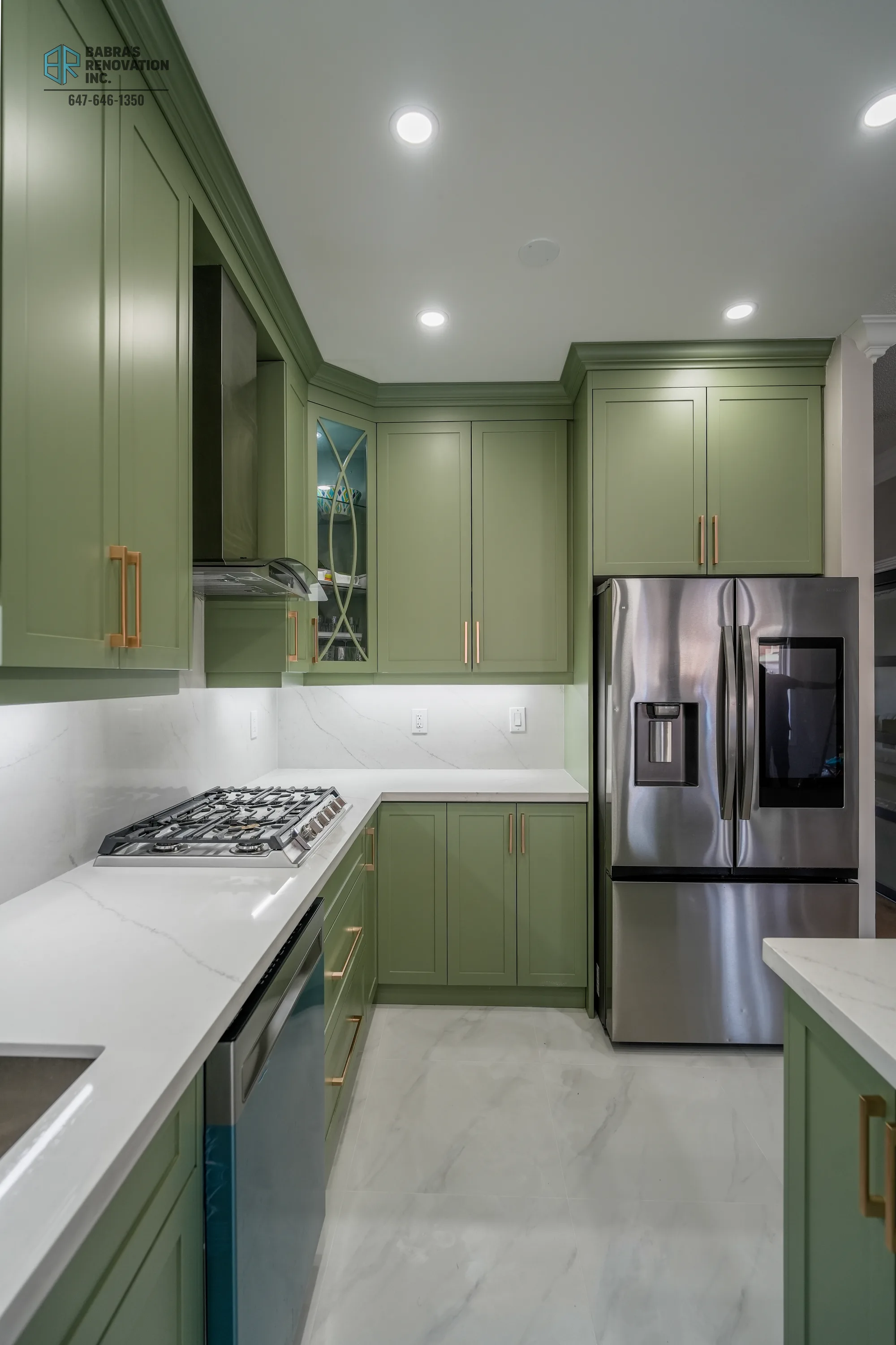 Kitchen with sage cabinets and stainless French-door refrigerator