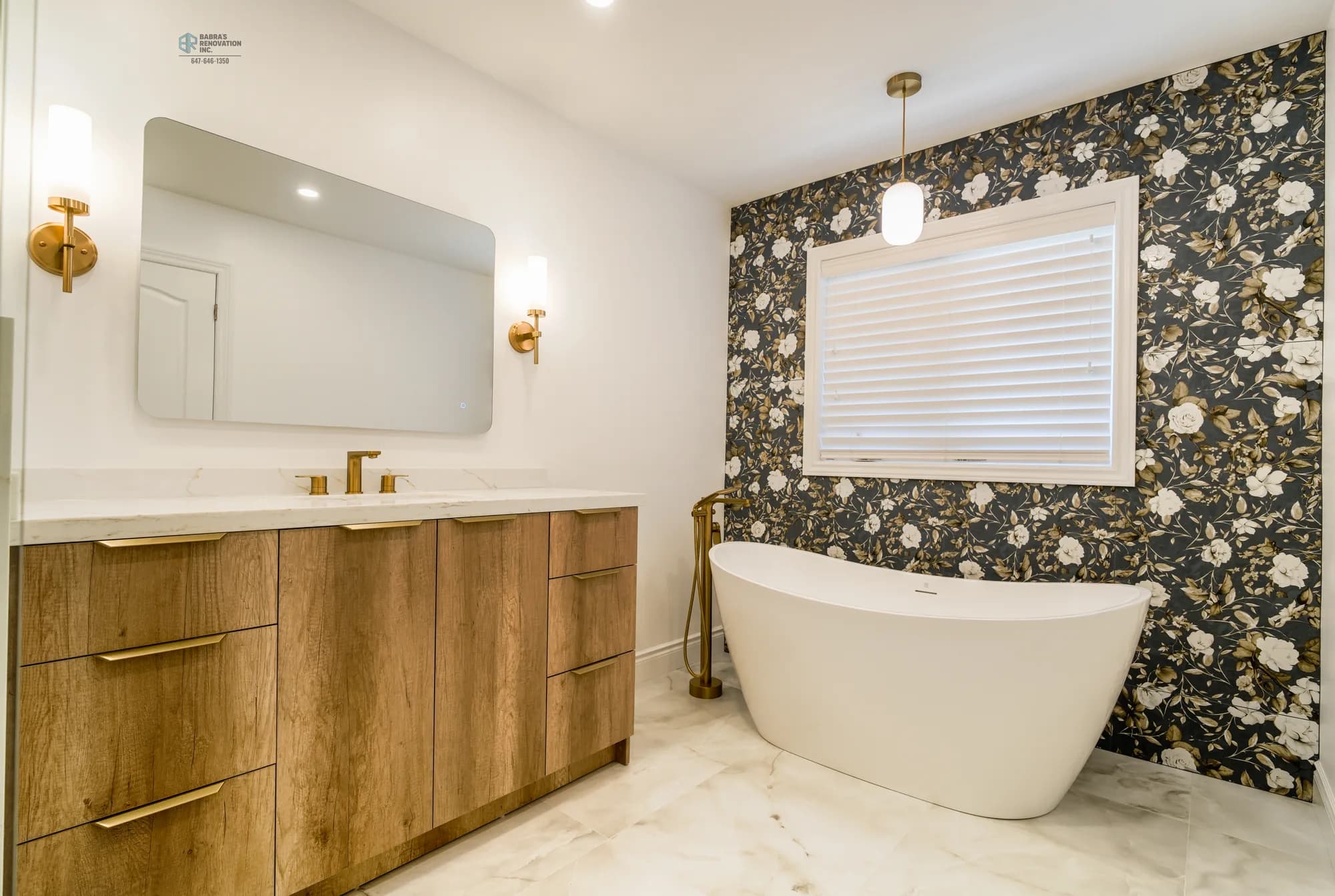 Bathroom with wood vanity, freestanding tub, and floral accent wall